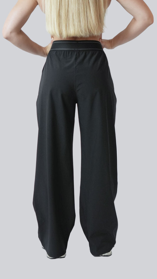 Back view of black AirWeight wide-leg pants with flat waistband – MELO Studio